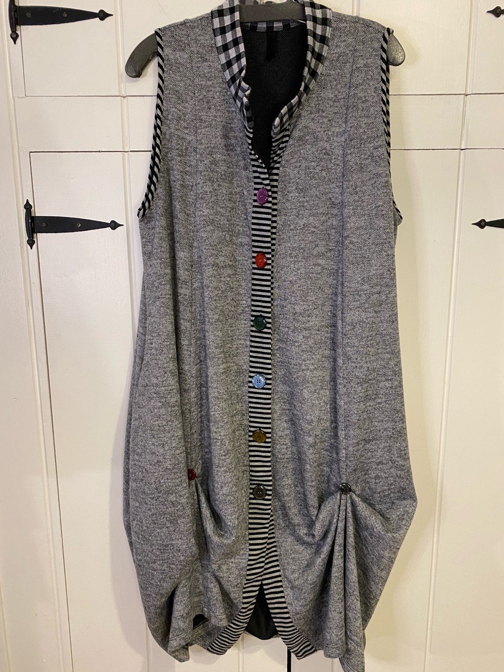 Lagenlook-style dress or long vest with button details and various fabrics.